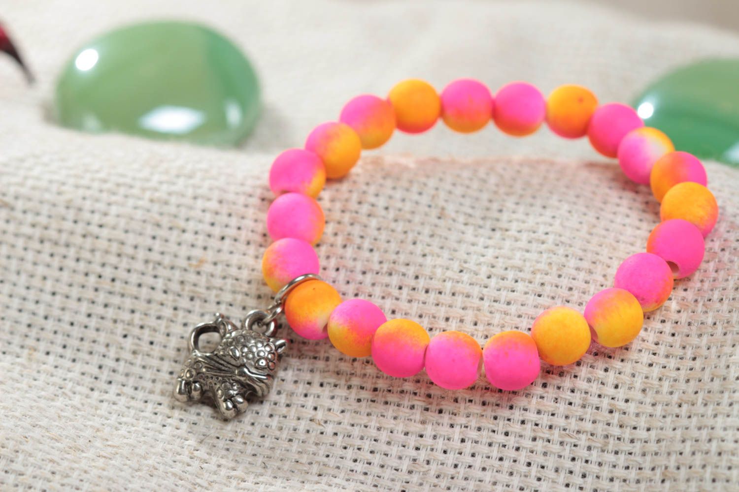 Bright pink handmade children's plastic bead bracelet with charm photo 1