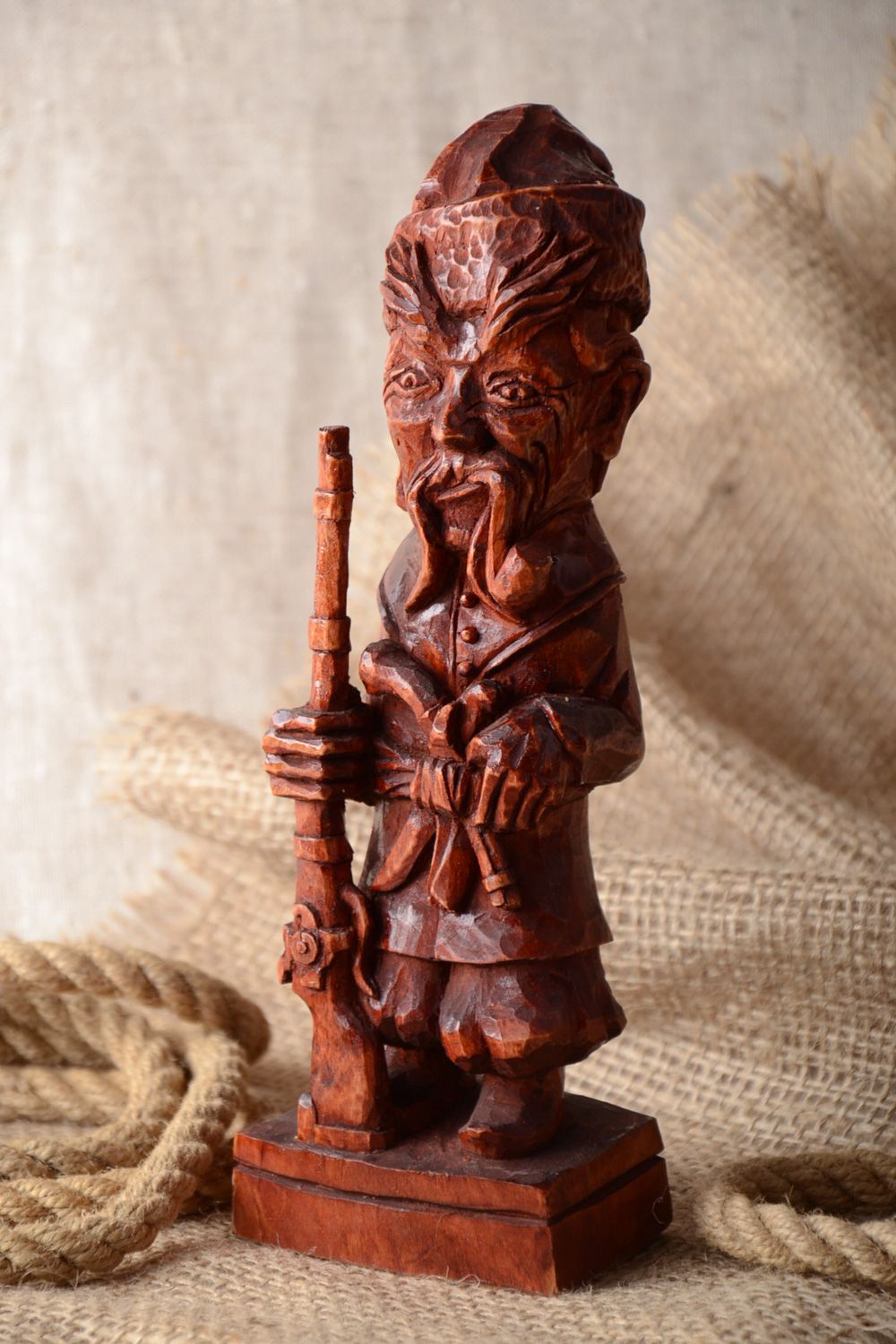 Handmade carved tinted wooden figurine coated with varnish for table decoration photo 1