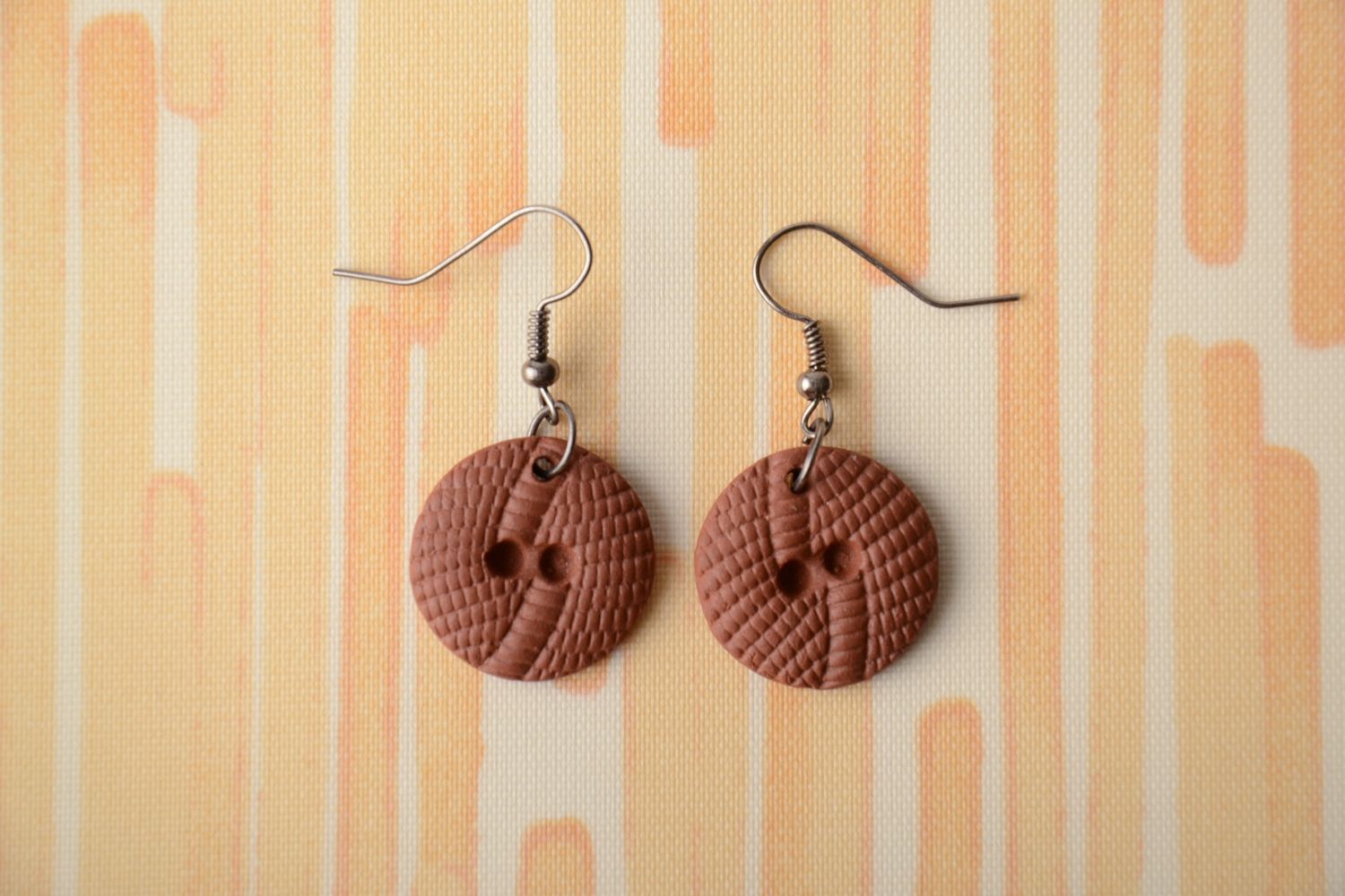 Round ceramic earrings in the shape of buttons photo 1