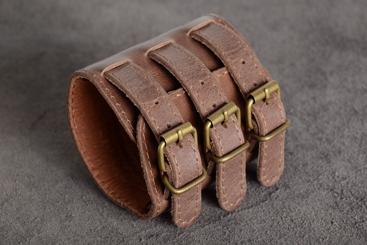 Handmade wide genuine leather bracelet of brown color with three buckles  photo 1