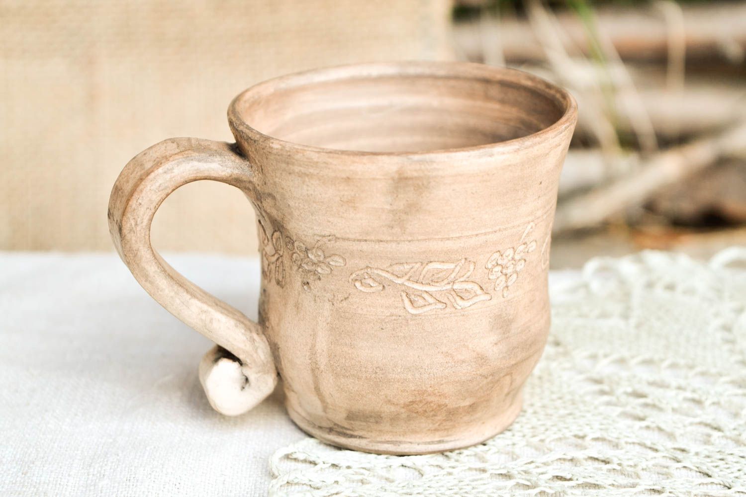 White clay rustic style handmade cup with floral pattern photo 1