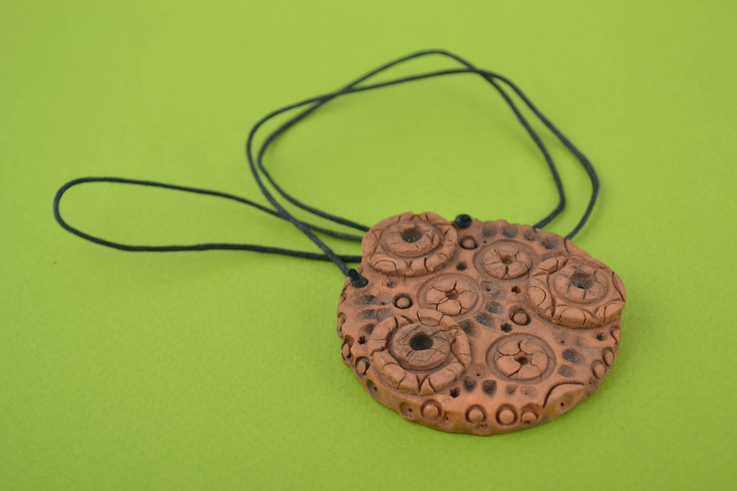 Beautiful round handmade designer ceramic neck pendant on cord photo 1