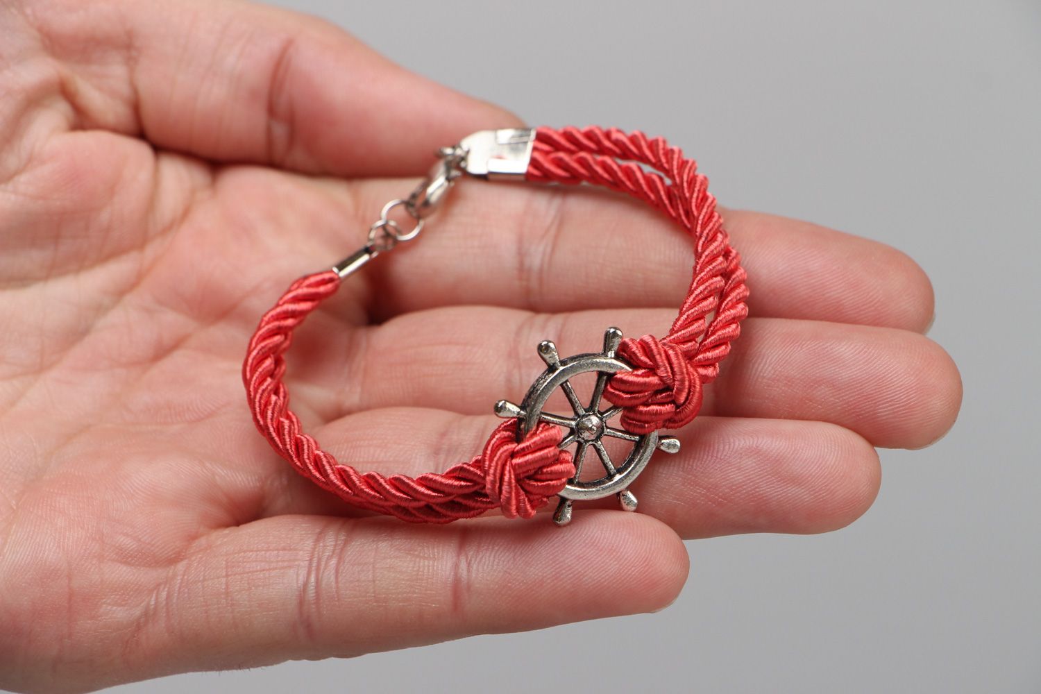 Handmade thin wrist bracelet with red cord and metal steering wheel unisex photo 3