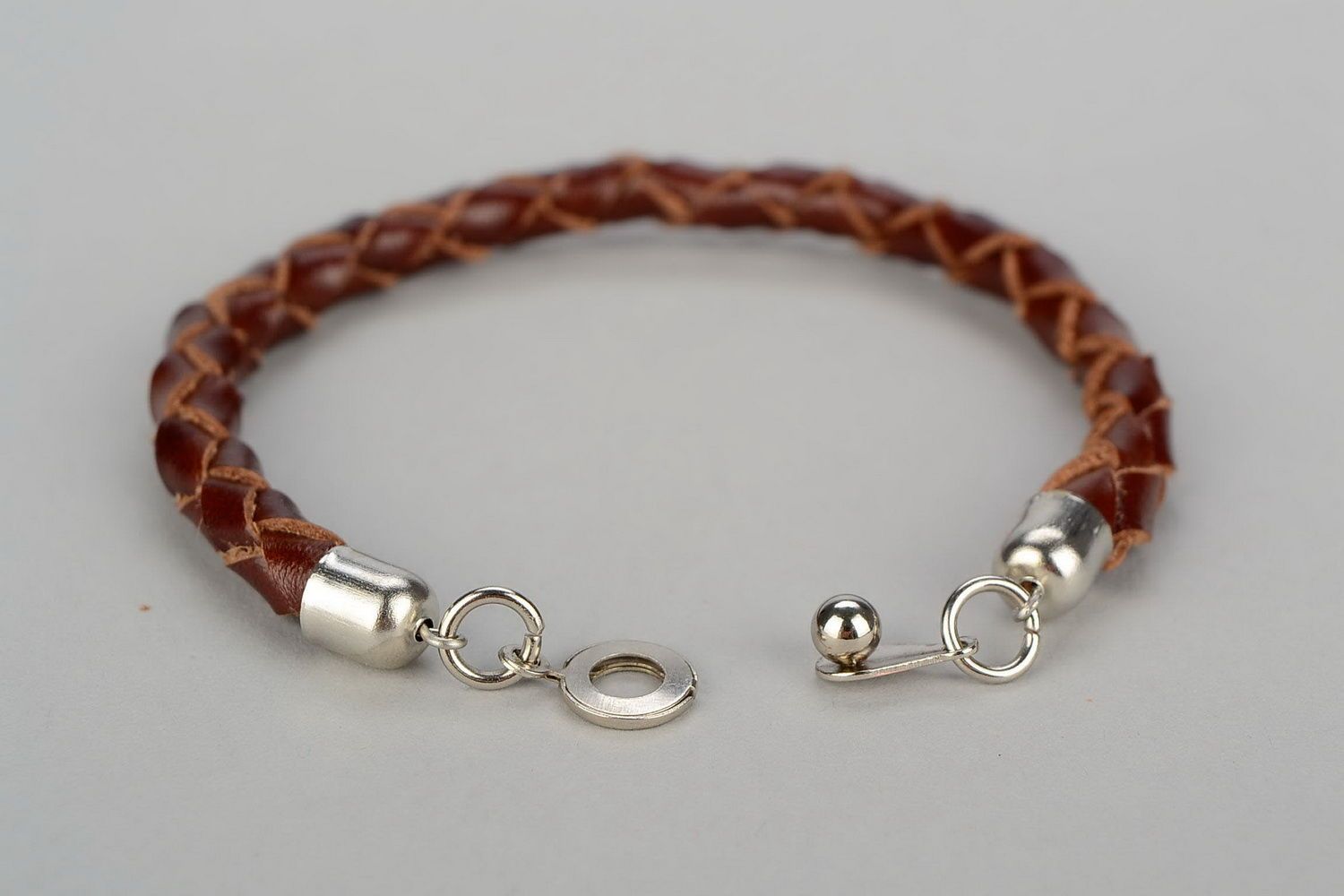 Round braided bracelet of brown color photo 2