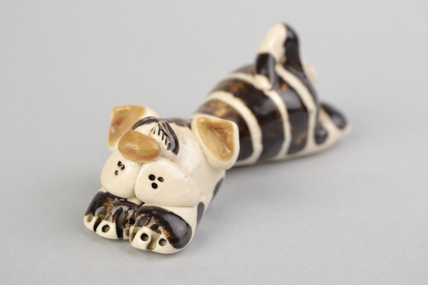 Cute homemade miniature ceramic figurine of striped cat painted with glaze photo 1