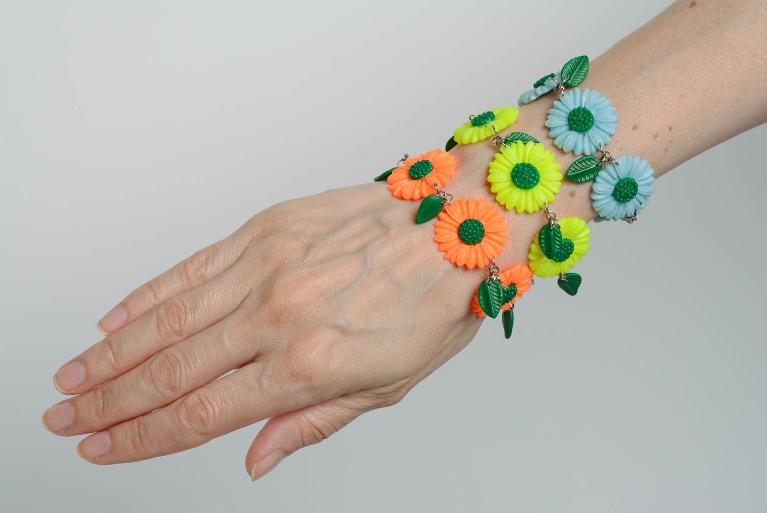Set of handmade designer plastic flower bracelets 3 pieces yellow orange and blue photo 1