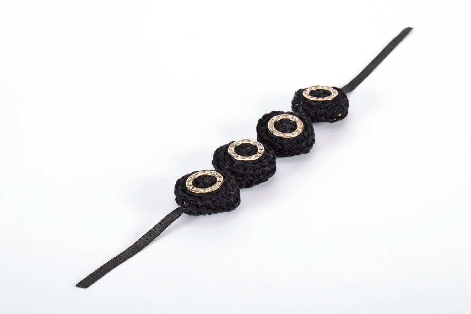 Knitted bracelet on wooden basis photo 3