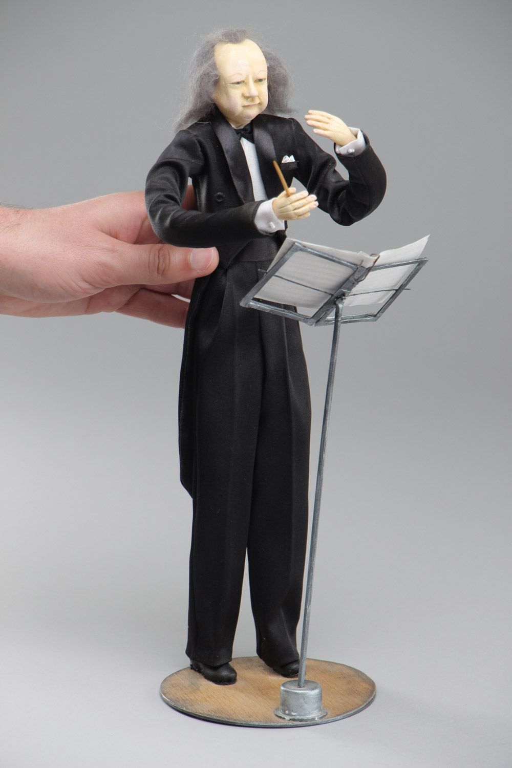 Handmade paperclay interior doll in the shape of conductor with holder  photo 5