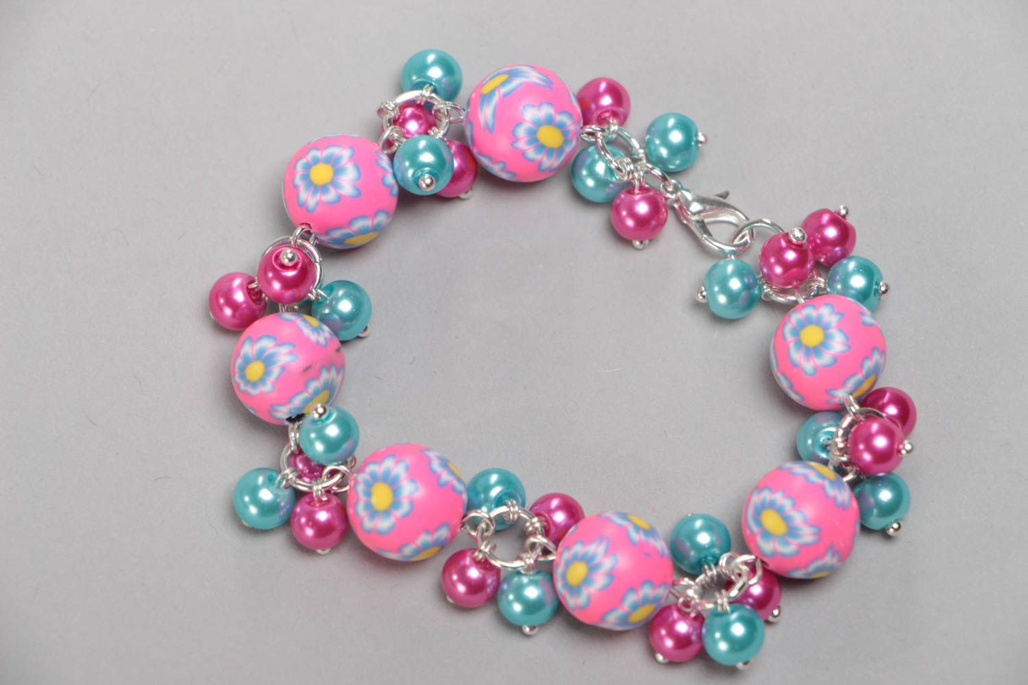Beautiful bright handmade children's bracelet with plastic and ceramic beads photo 3