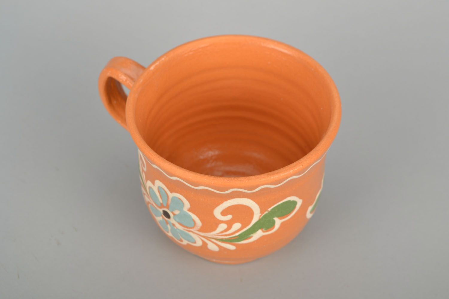 Medium size terracotta color coffee cup with handle and floral design photo 4
