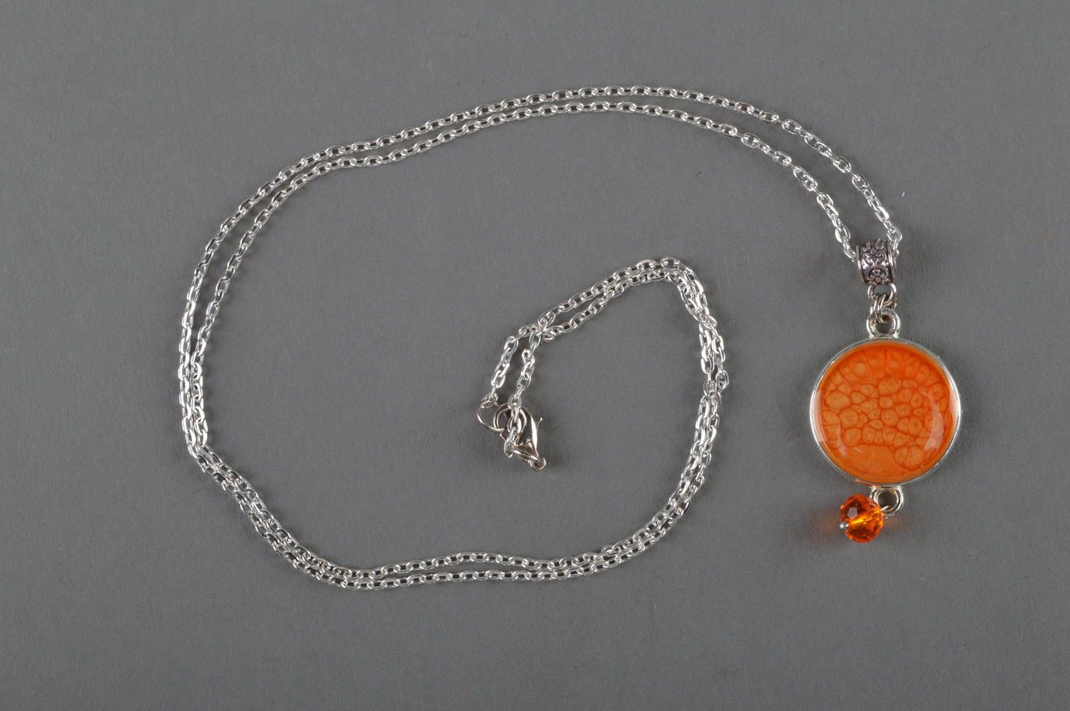 Handmade designer orange epoxy pendant decorated with decoupage and equipped with metal chain photo 1
