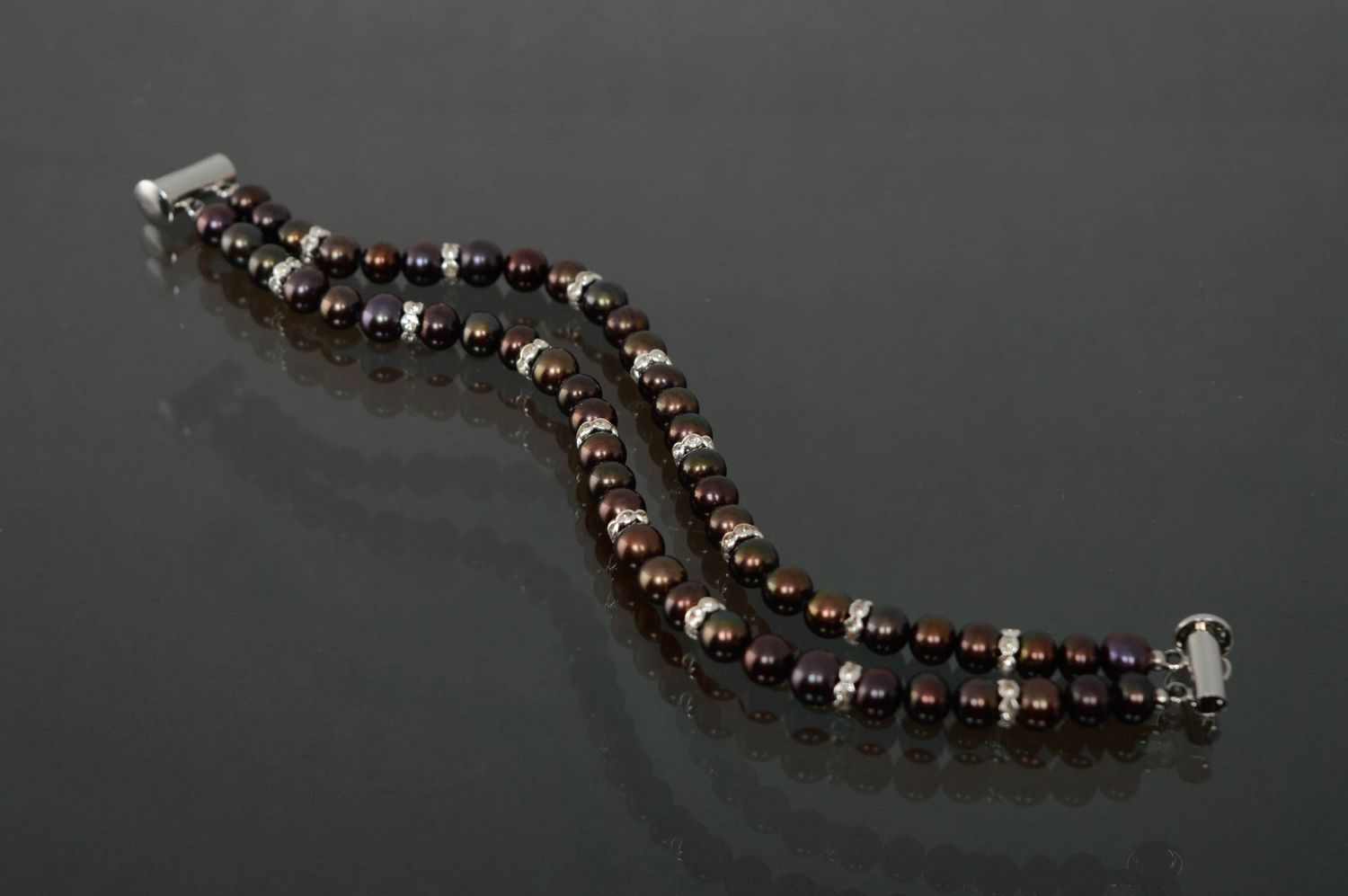 Designer bracelet with dark pearls photo 2