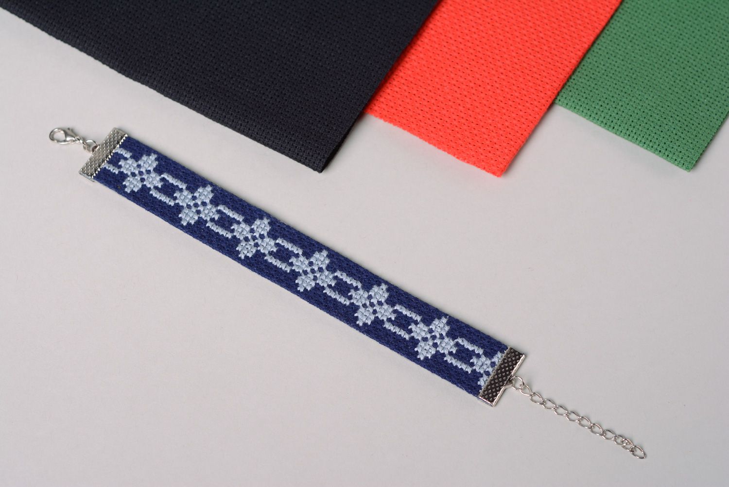 Handmade women's wrist embroidered bracelet in ethnic style in blue color palette  photo 1