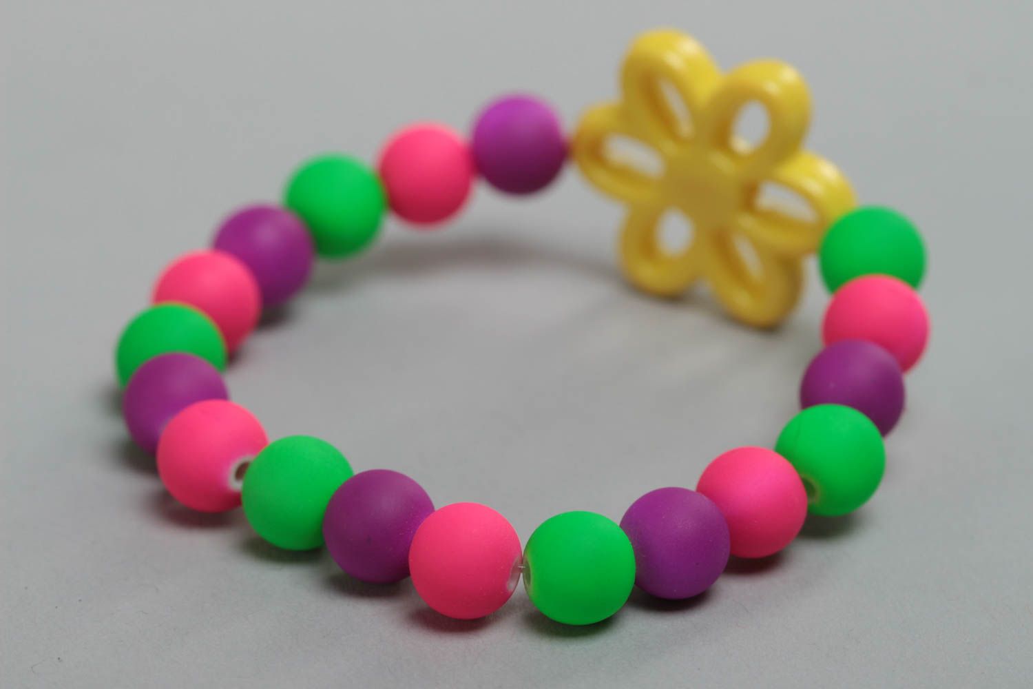Unusual bright handmade children's plastic ball bracelet with flower photo 3