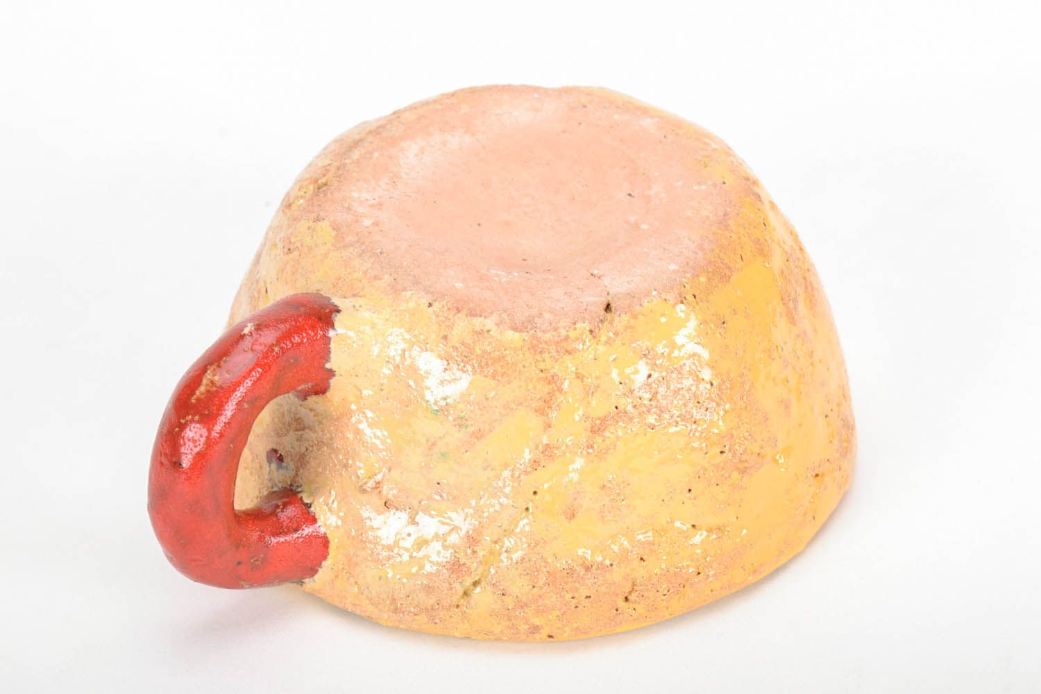Hand-molded clay glazed cup in yellow and red colors. Wide cup with white inside glaze. photo 3