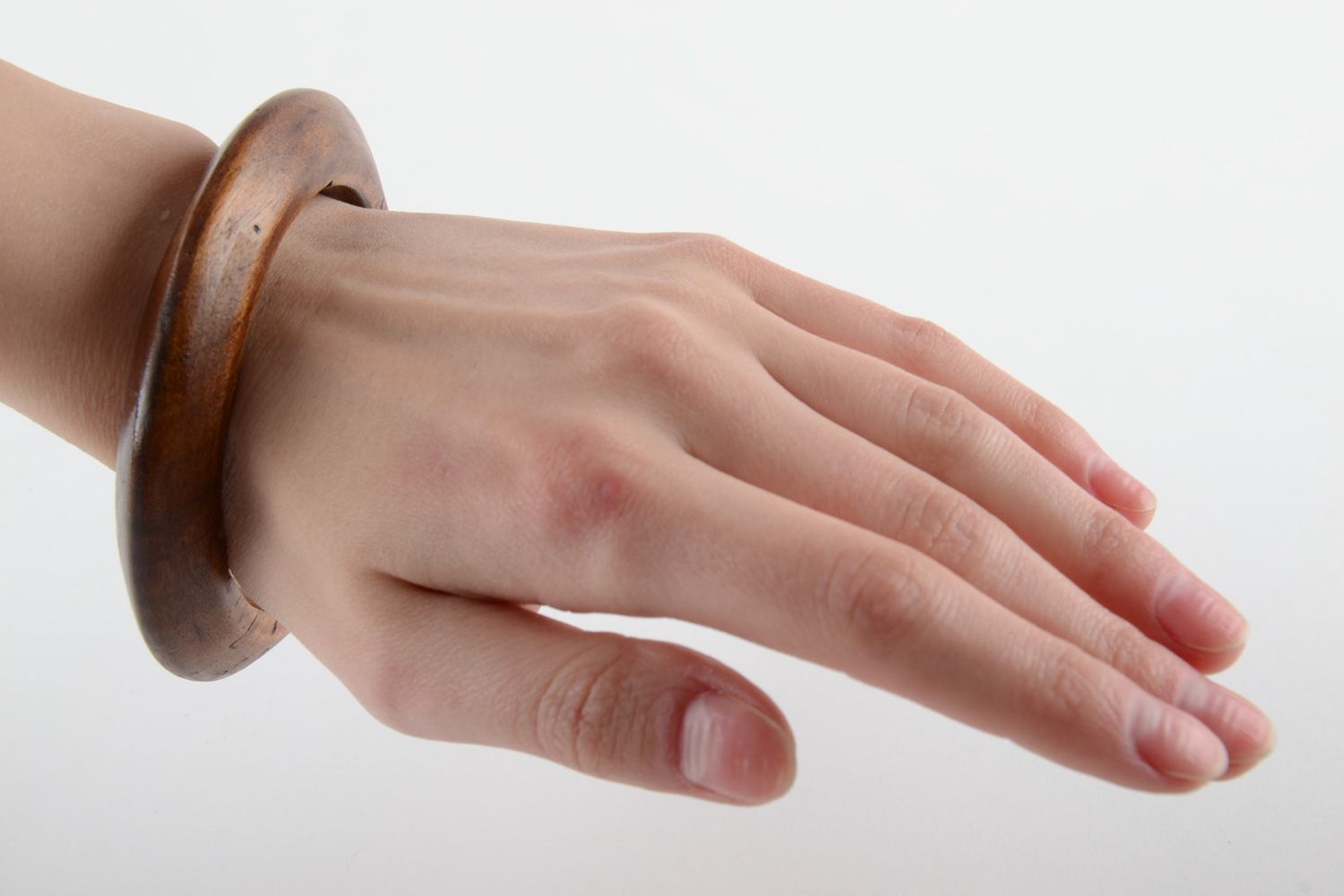 Elegant thin handmade wrist bracelet carved of wood and varnished for women photo 5