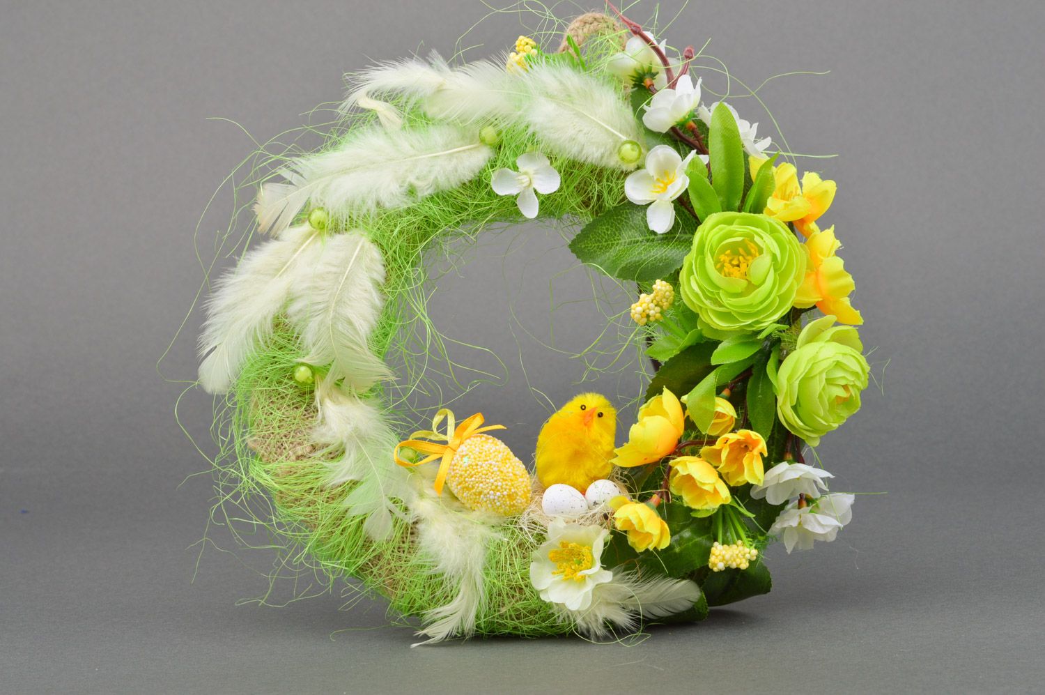 Handmade Easter wreath for home interior made of burlap with green feathers photo 2