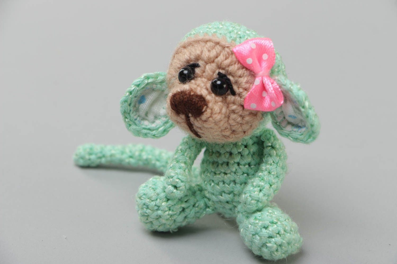 Handmade small funny soft toy crocheted of acrylic threads Green Monkey with bow photo 2