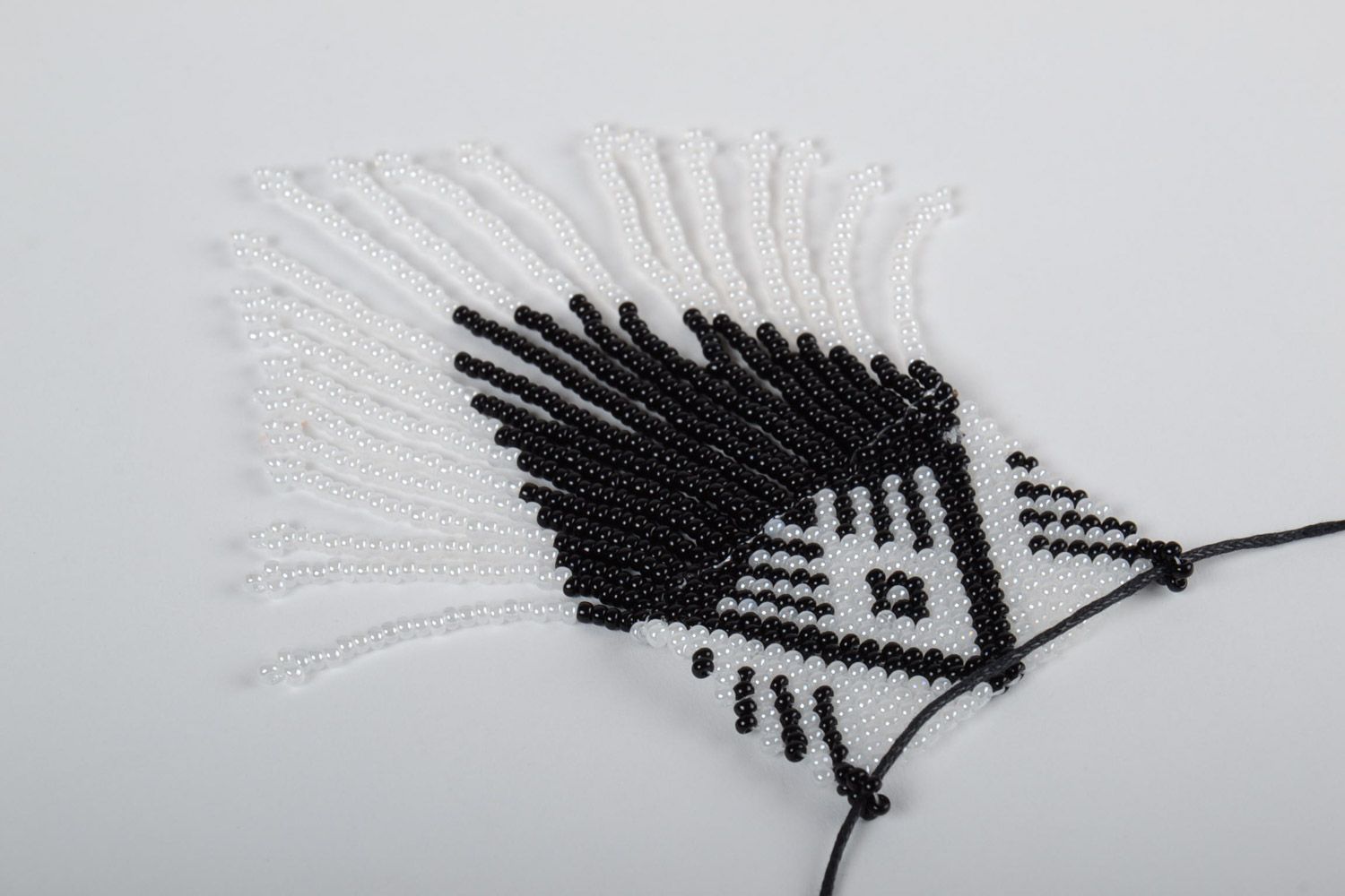 Black and white handmade beaded pendant with fringe and synthetic cord photo 3