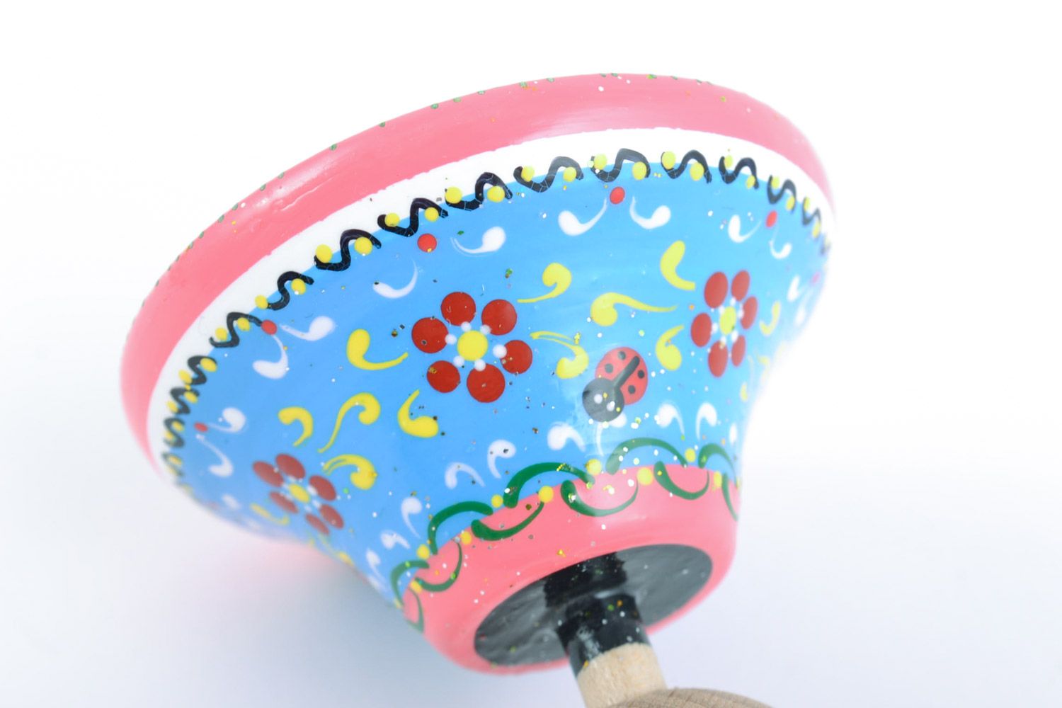 Homemade wooden eco friendly toy spinning top painted in blue and pink colors photo 4
