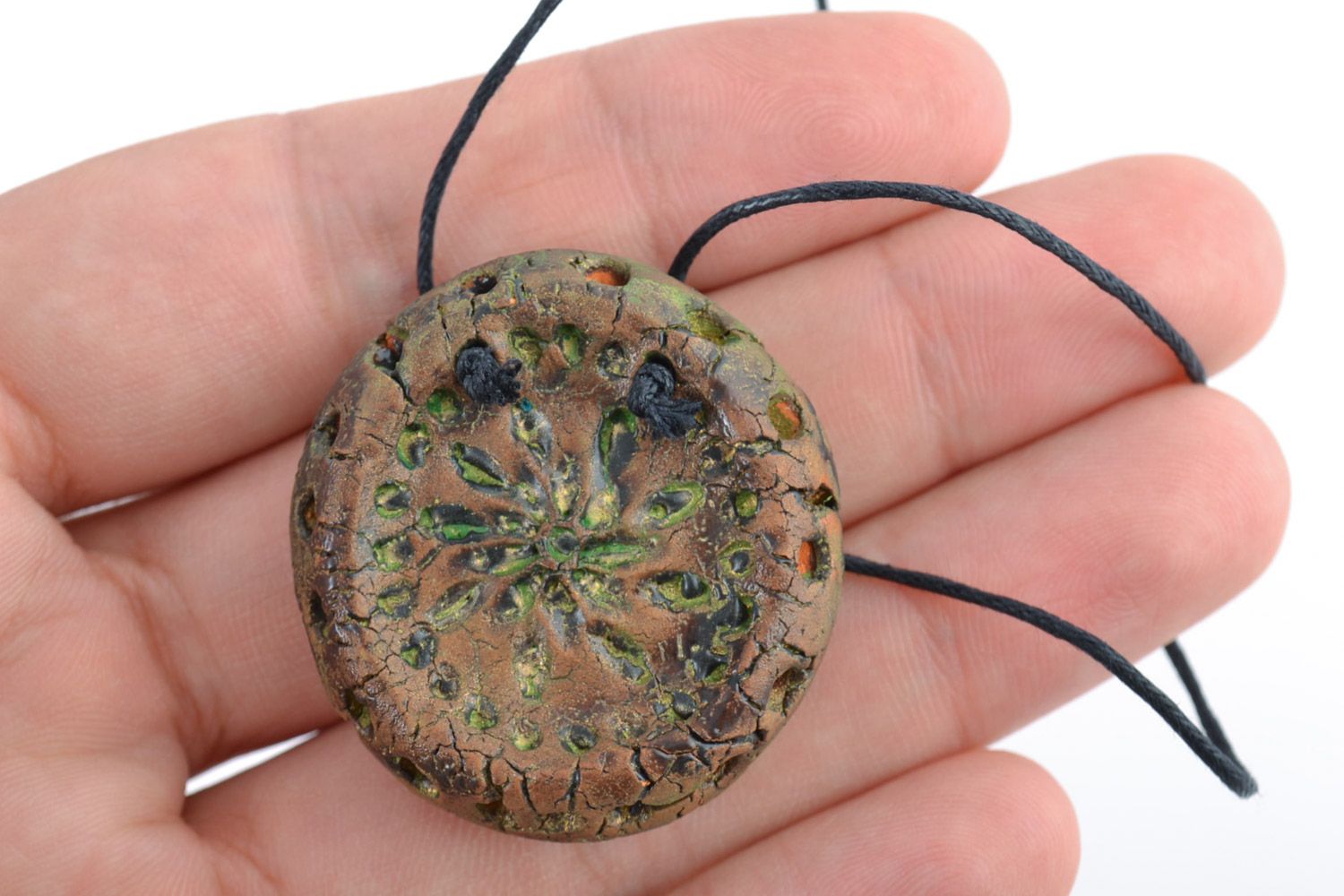 Handmade volume ceramic pendant of round shape with ornament painted with acrylics photo 2