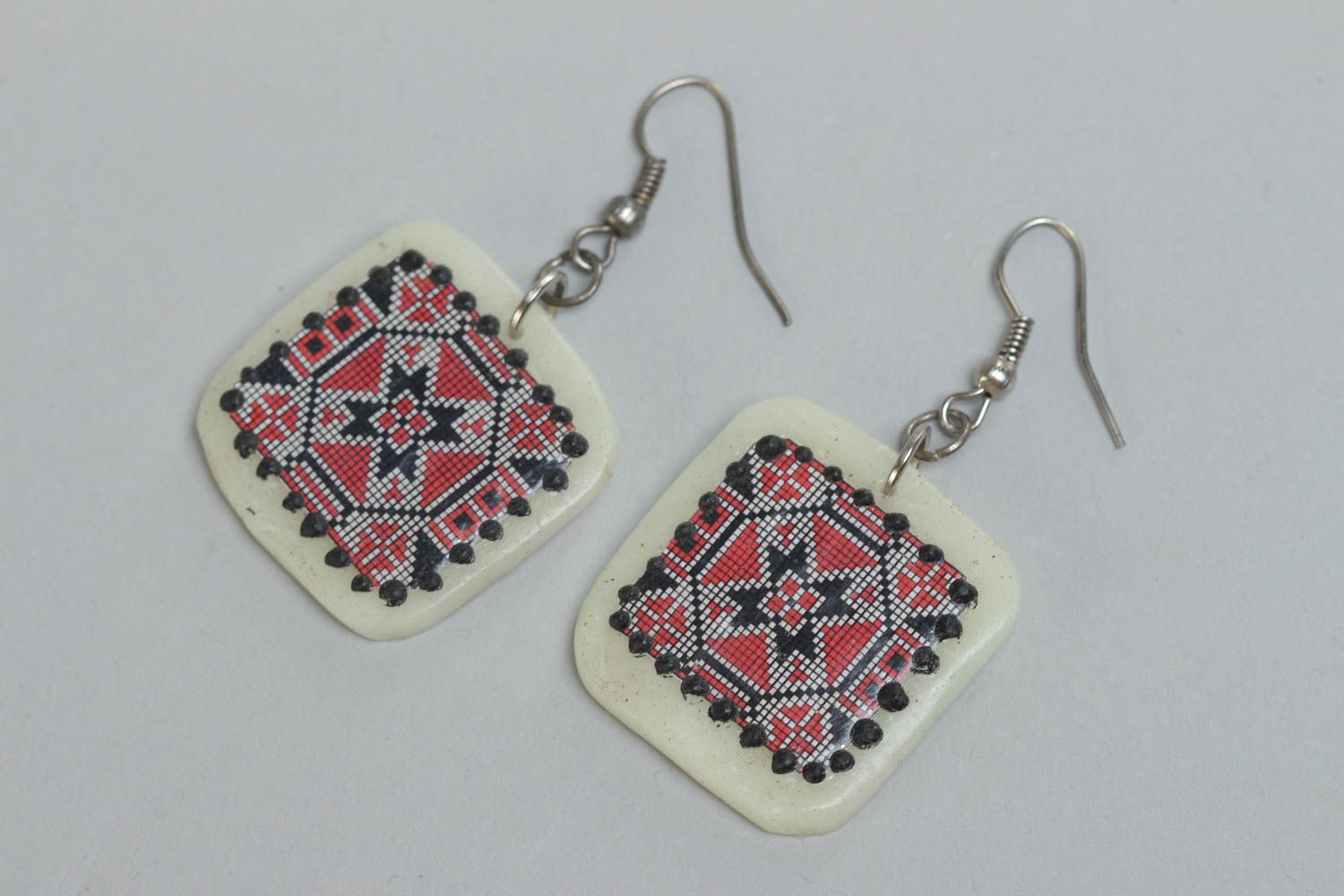 Handmade polymer clay white earrings with red and black ornament in ethnic style photo 2