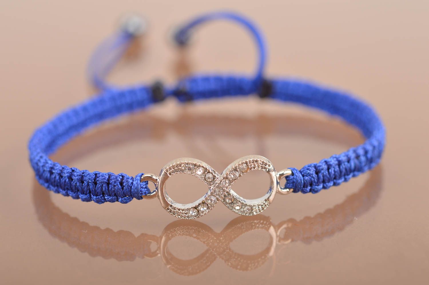 Handmade stylish thin blue woven wrist bracelet made of silk with insert photo 2
