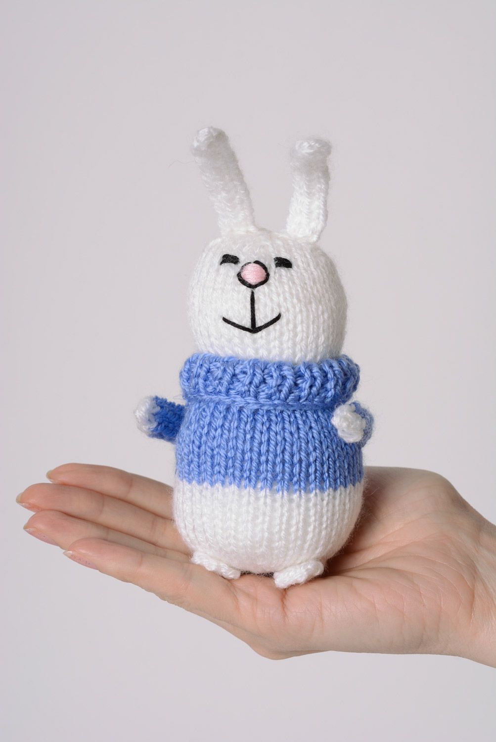 Handmade knitted soft toy smiling white bunny in blue sweater photo 3