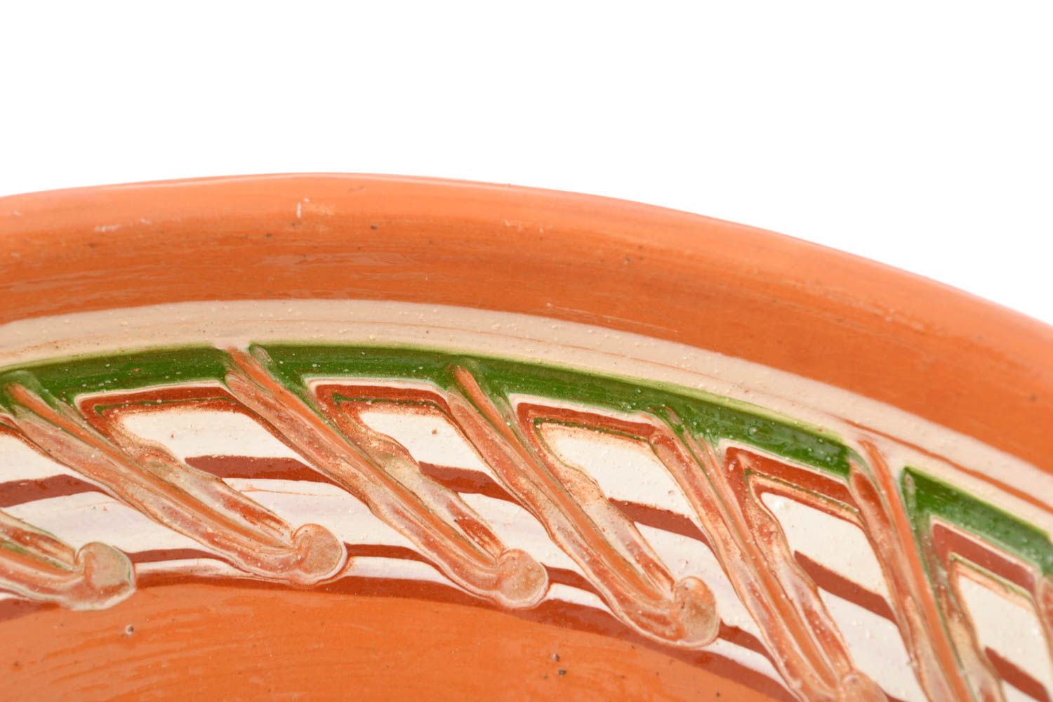 Glazed ceramic bowl made using engobes ornamenting technique photo 3