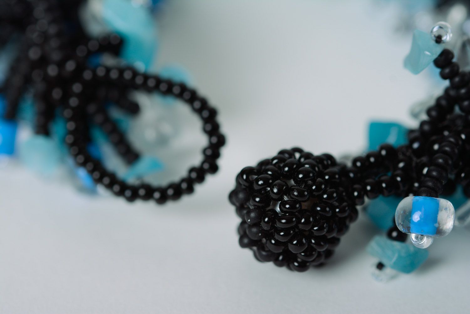 Handmade designer wrist bracelet woven of black and blue beads for women photo 5
