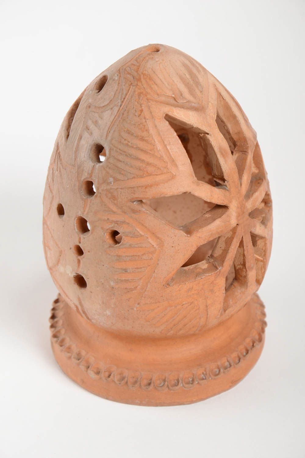 Глиняный подсвечник в форме яйца ручной работы покрытый воском красивый фото 3