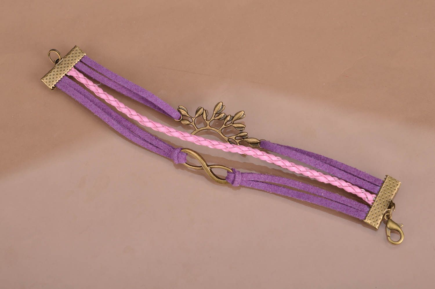 Handmade violet and pink suede cord multi row wrist bracelet with metal inserts photo 2