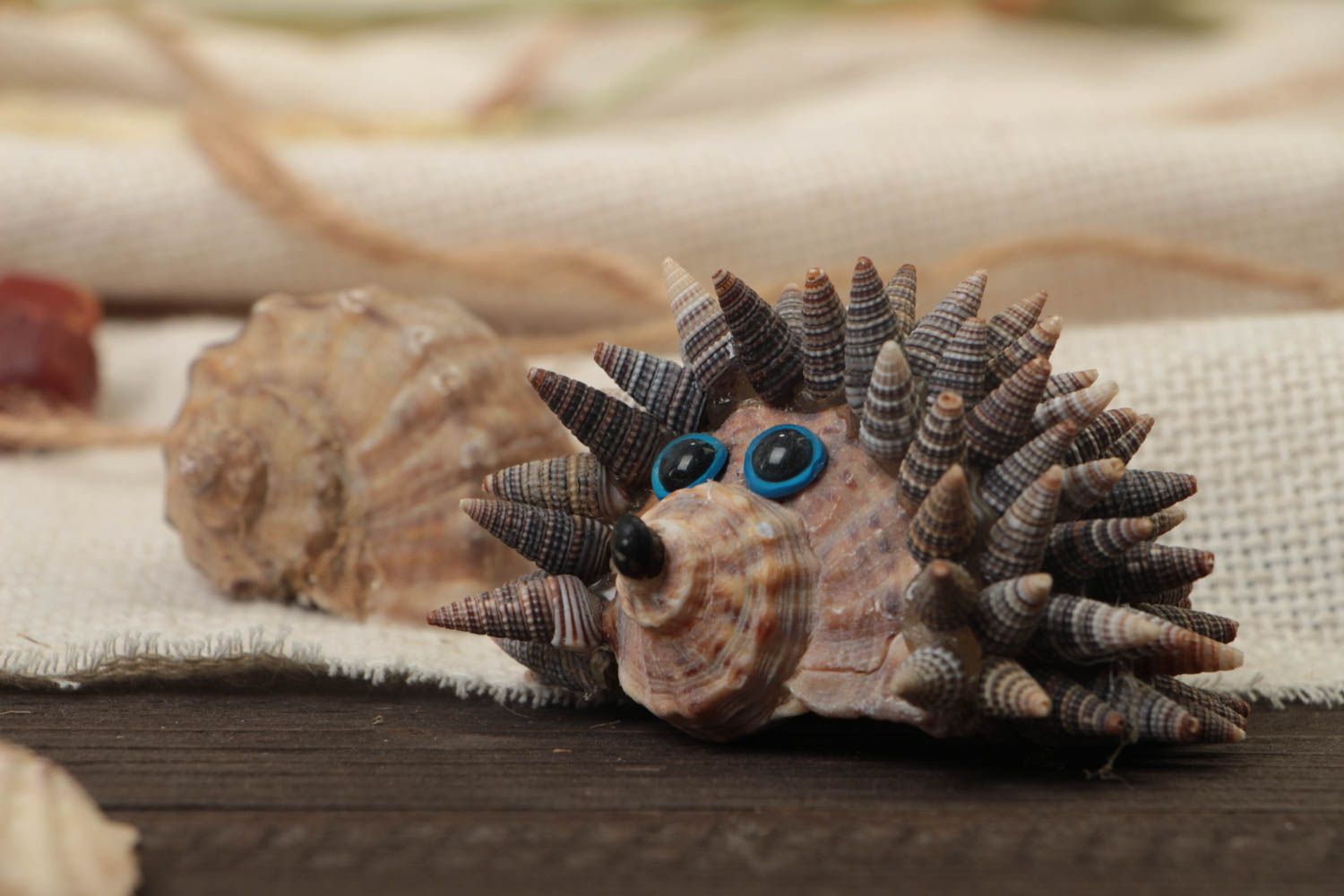 Decorative handmade hedgehog created of seashells interesting table decor photo 1