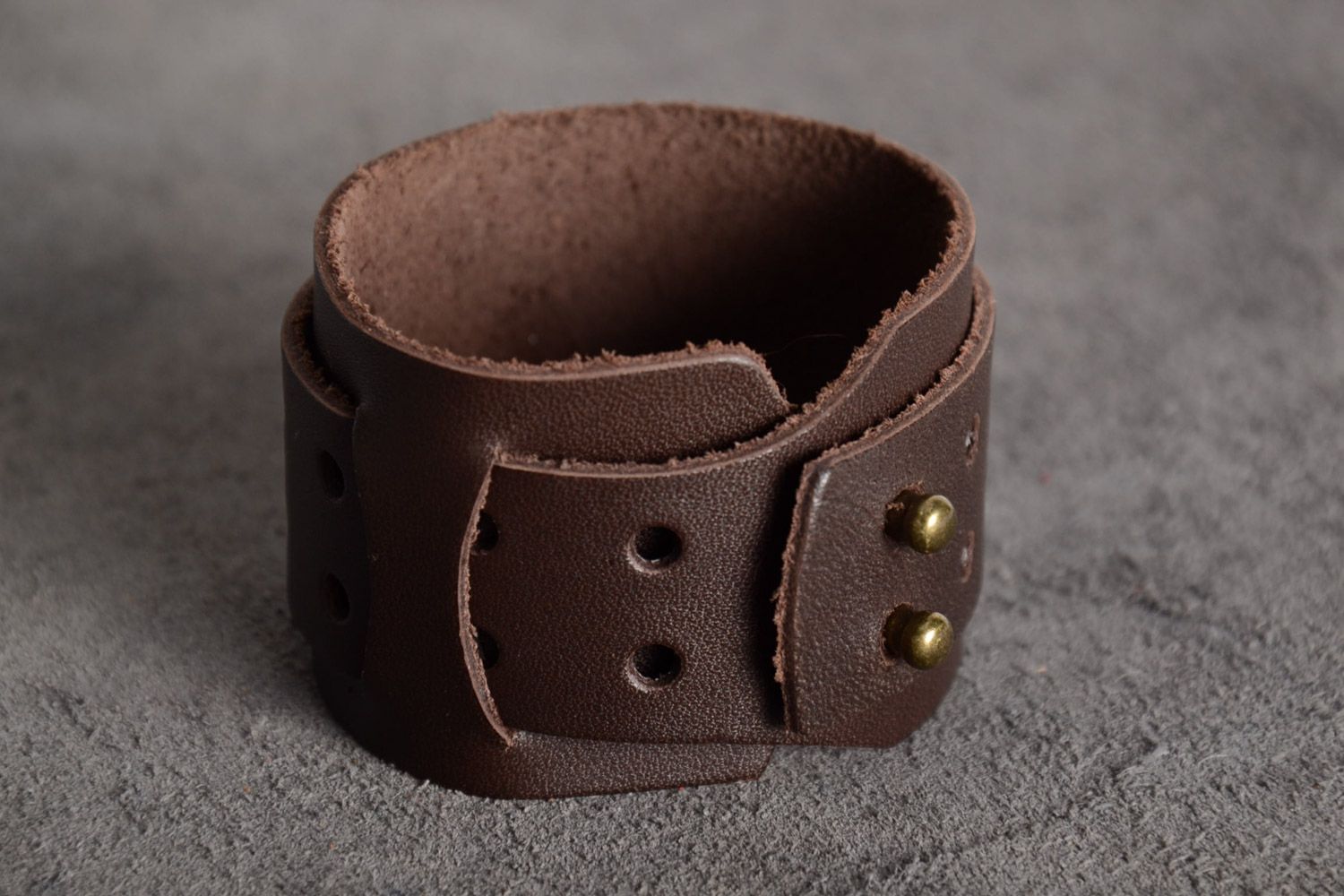 Handmade massive genuine leather wrist bracelet of brown color with metal elements photo 1