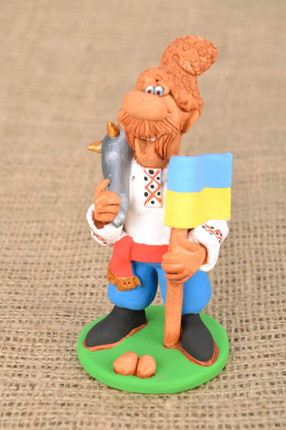 Homemade funny clay statuette Cossack with a Flag and a Saber photo 1