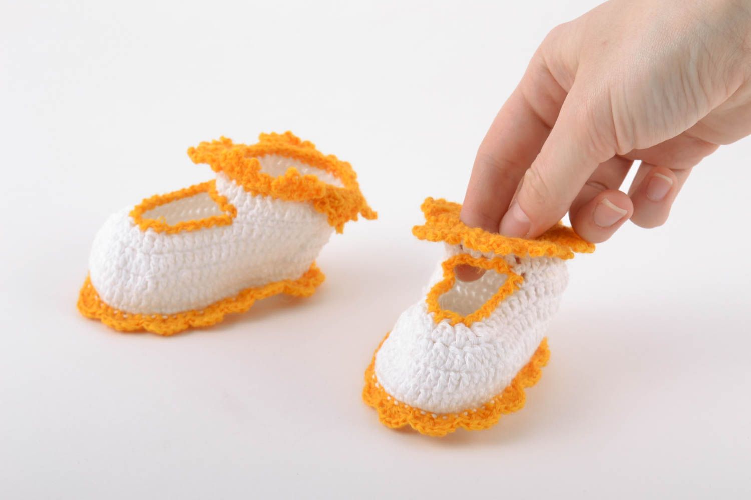 Handmade baby booties crocheted of natural white and orange cotton threads photo 2