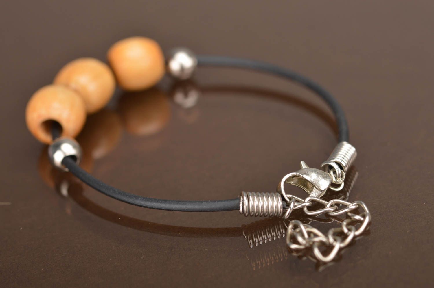 Handmade laconic simple rubber cord wrist bracelet with light wooden beads photo 5