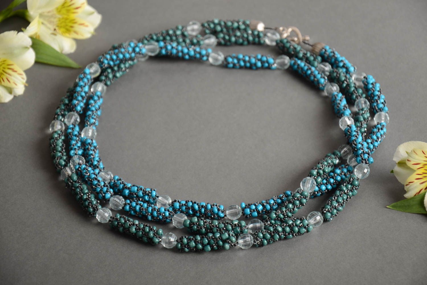 Handmade long women's necklace crocheted of Czech beads of turquoise color photo 1