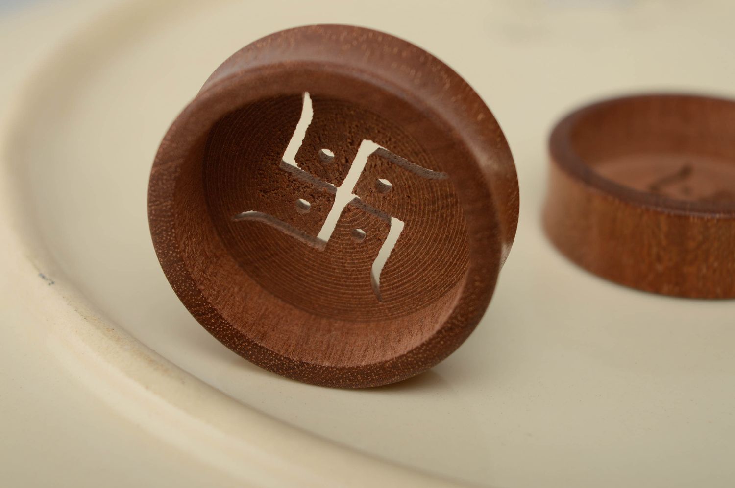 Sapele wood ear plugs with image of swastika photo 1