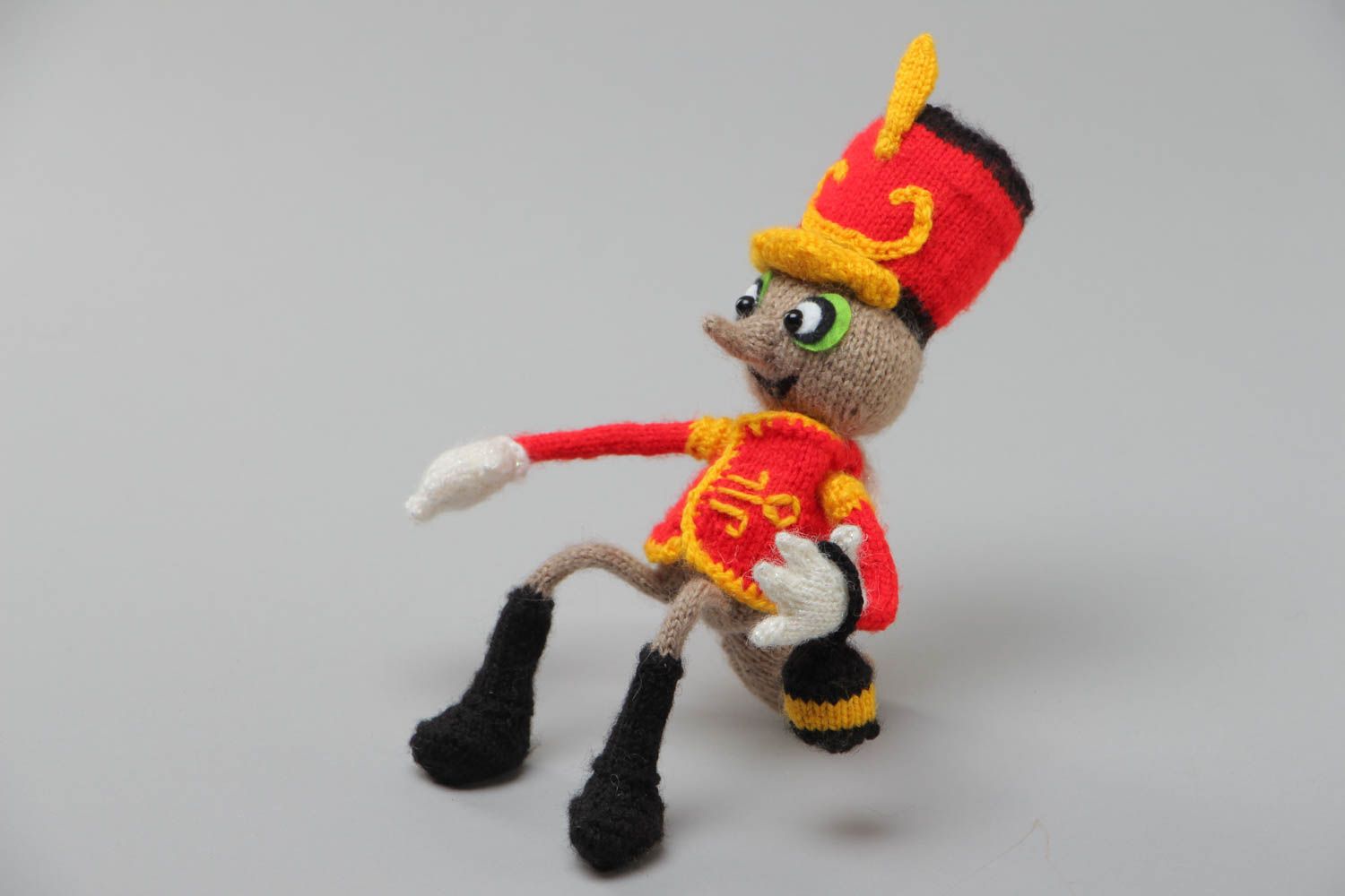 Handmade small soft knit toy in the shape of a mosquito in hussar uniform photo 2