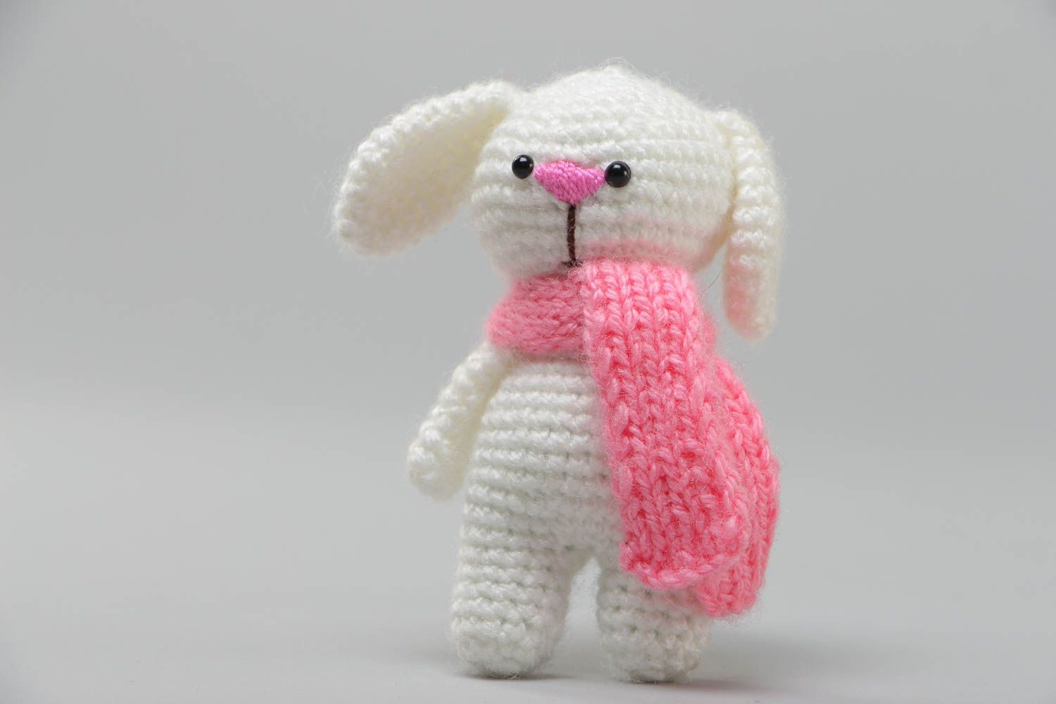 Handmade soft toy crocheted of acrylic threads white rabbit with pink scarf photo 2
