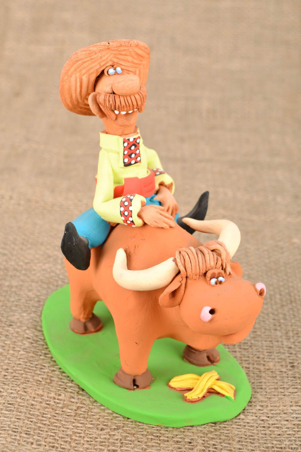 Homemade clay statuette Cossack riding a bull photo 1