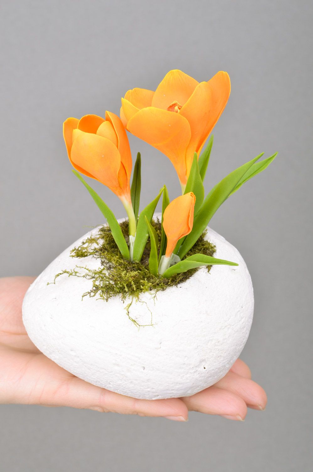 Handmade decorative crocus flower of orange color molded of polymer clay on stone photo 5