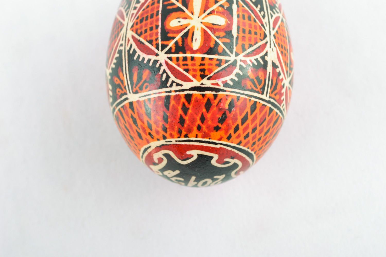 Homemade ornamented chicken egg with wax painting Easter decoration for home photo 3