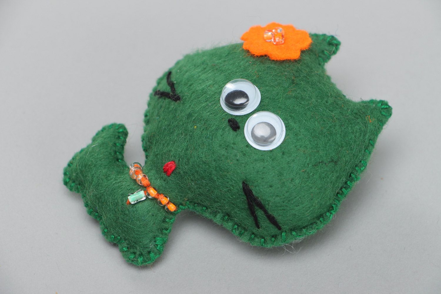 Small cute homemade soft toy sewn of green felt little kitten with orange flower photo 2