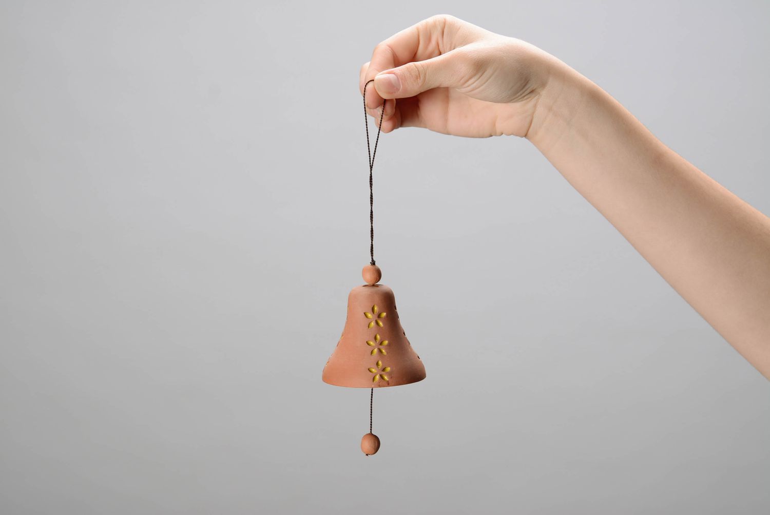 Bell made from red clay photo 2