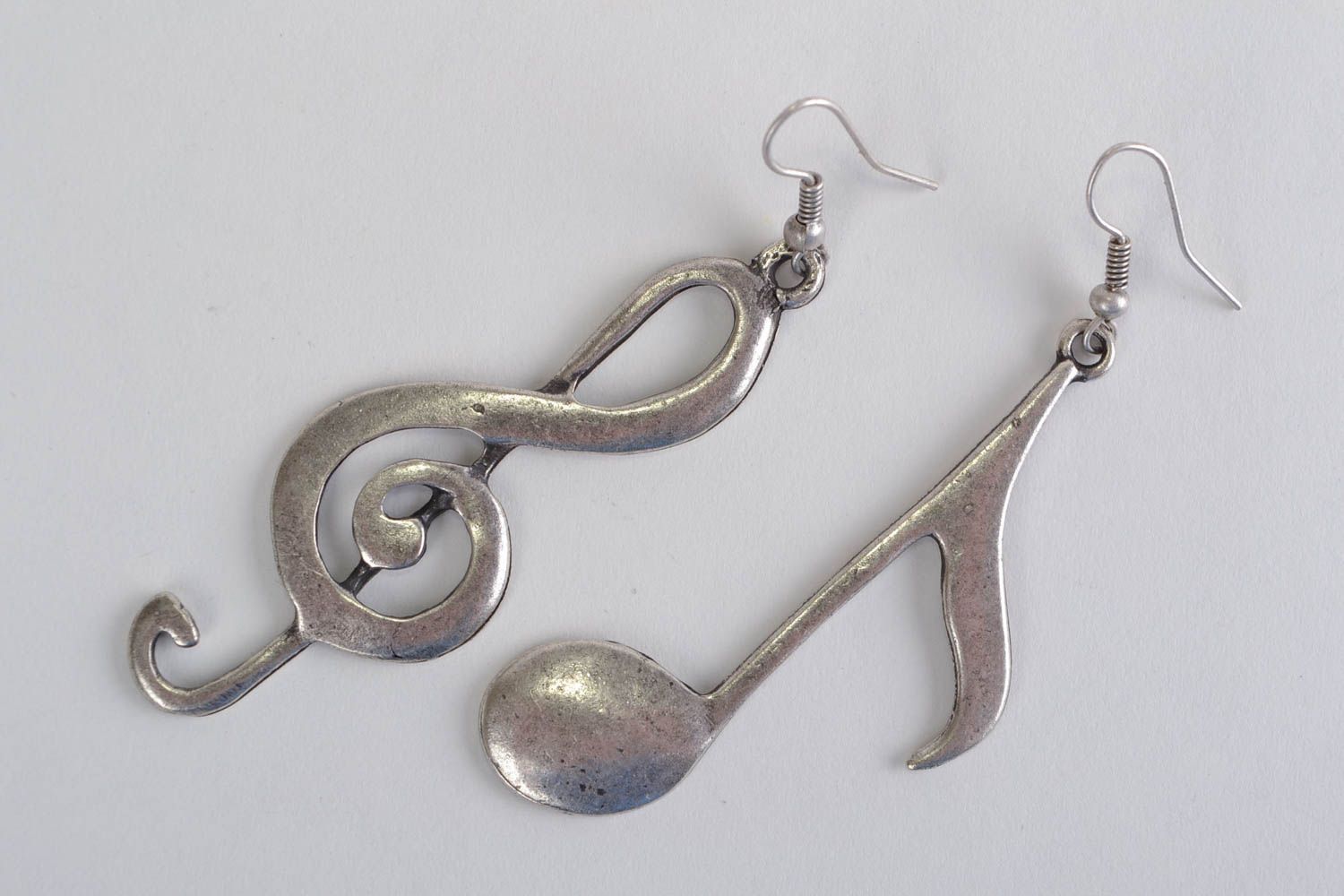 Unusual design handmade cast metal dangle earrings in the shape of notes photo 1