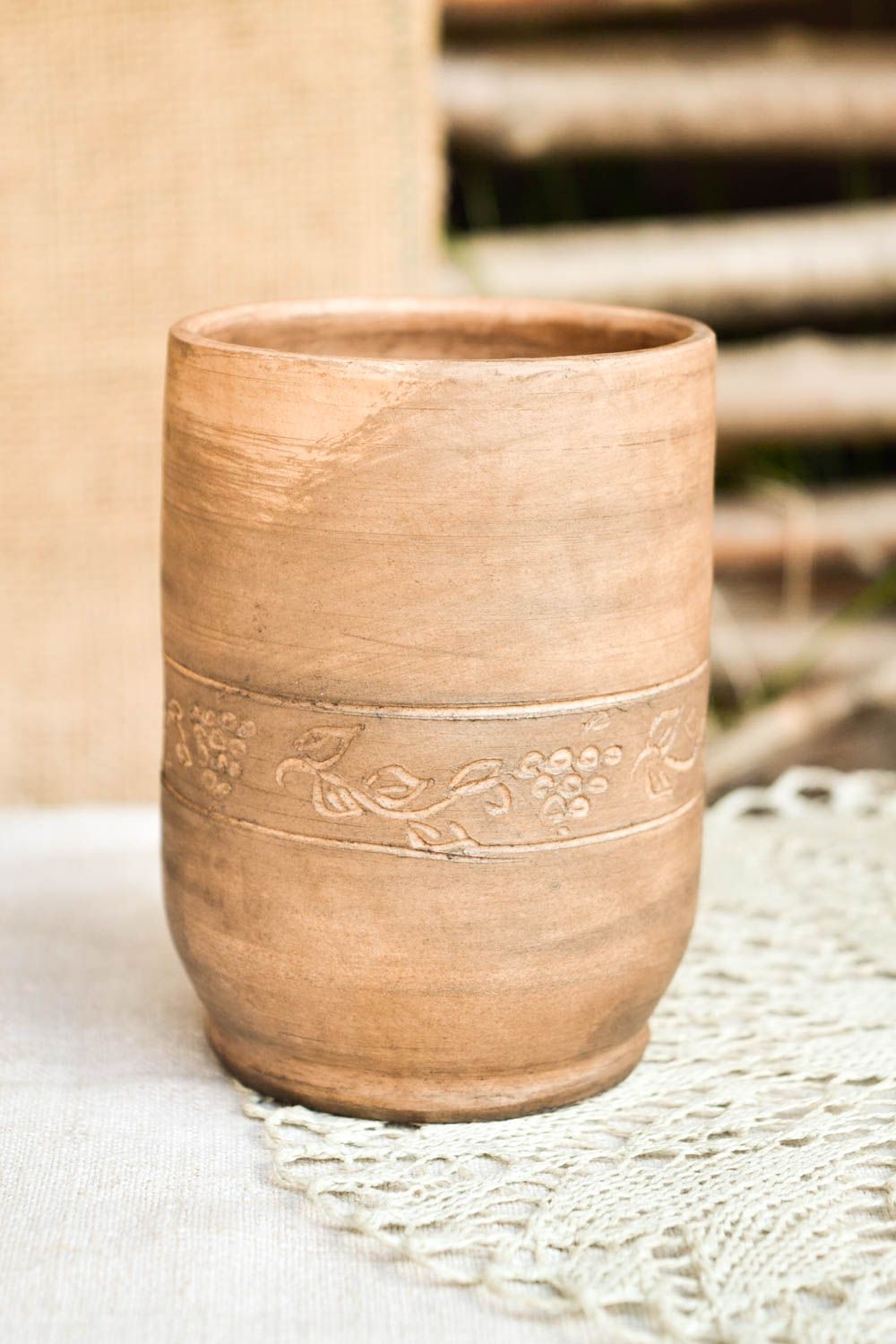 Tall 10 oz clay rustic cup with no handle with plain floral pattern photo 1