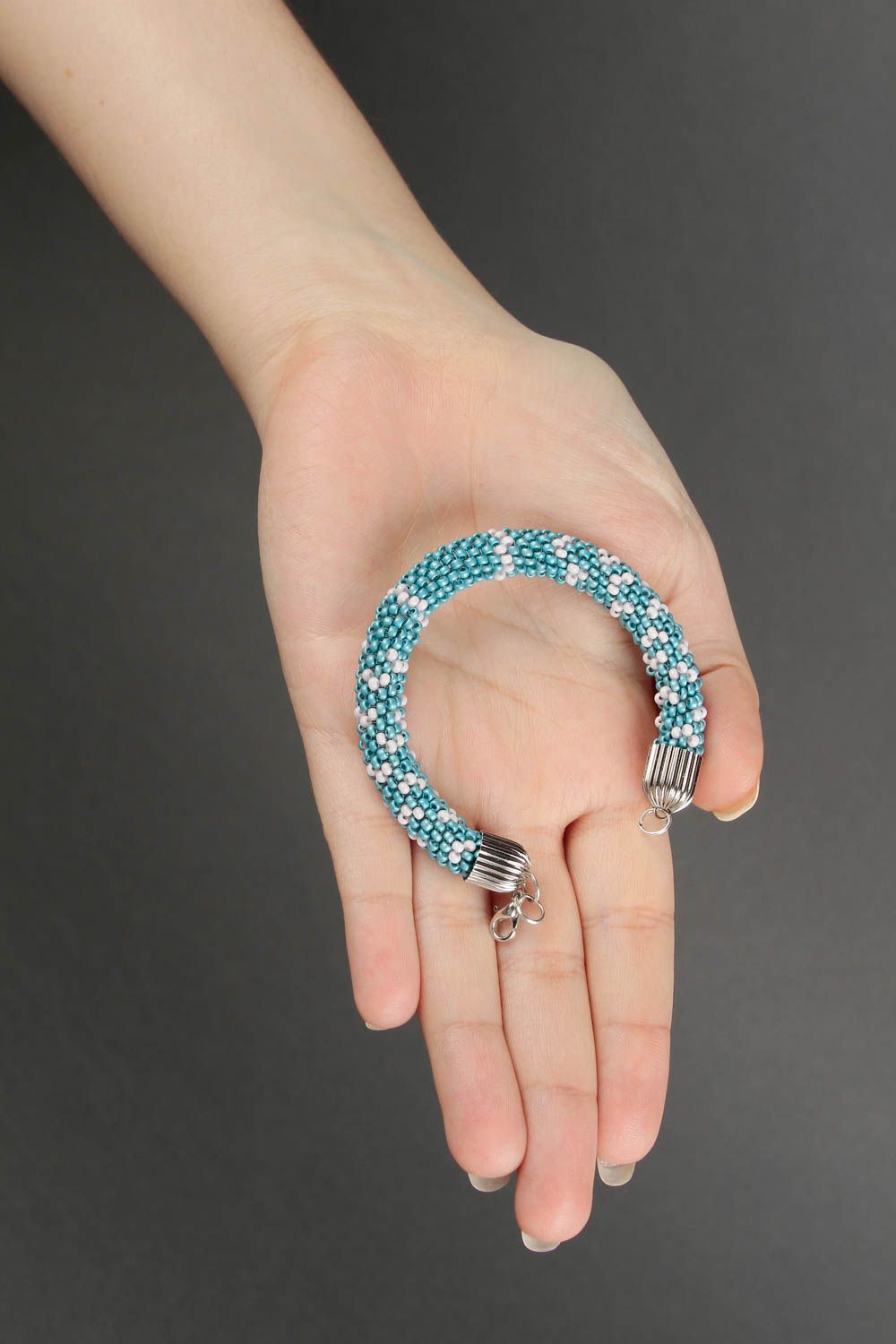 Handmade beaded cord bracelet in turquoise and white beads photo 2