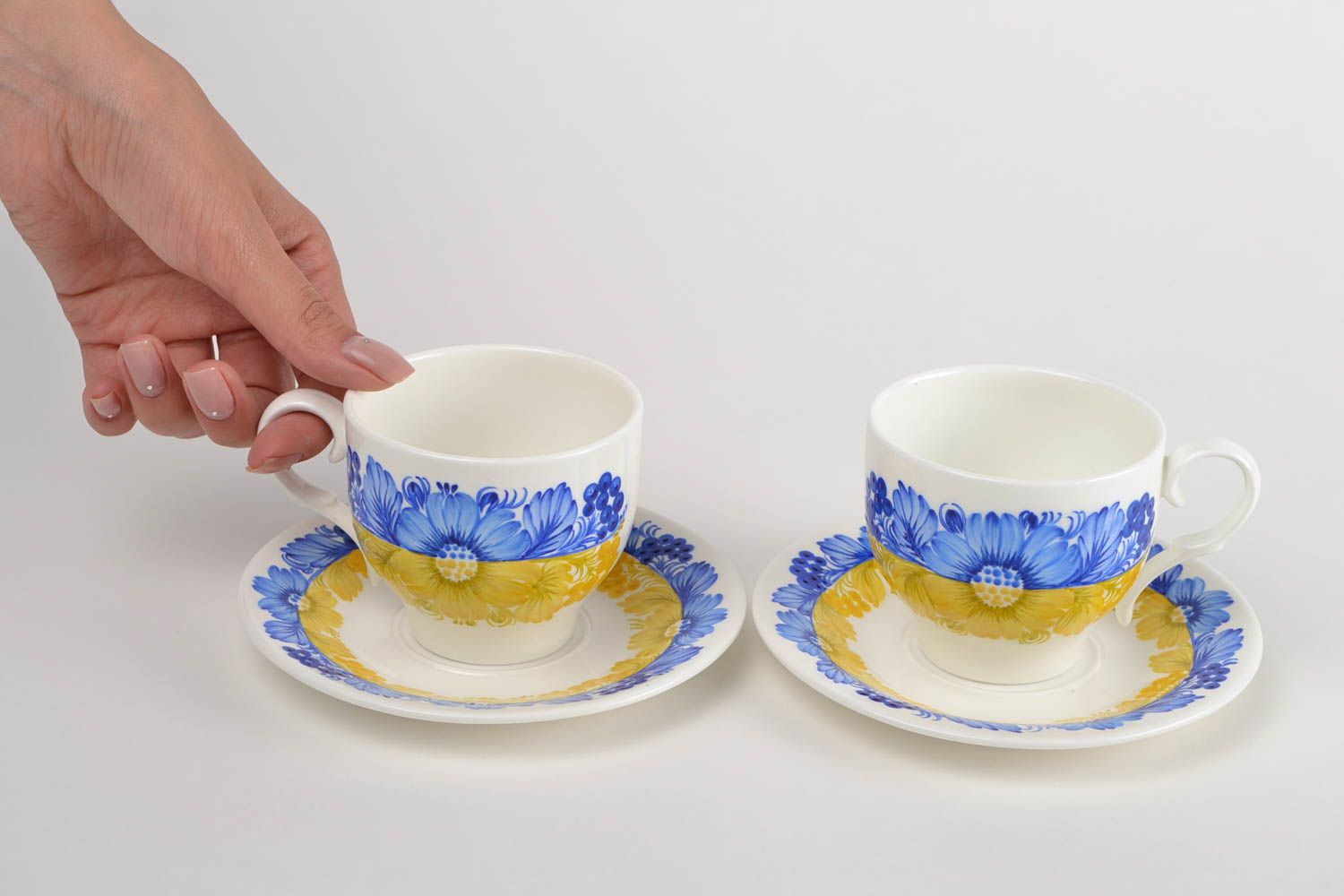 Set of 2 two teacups in white, blue, and yellow colors with saucers photo 2